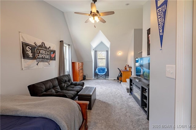 carpeted bedroom featuring lofted ceiling and ceiling fan