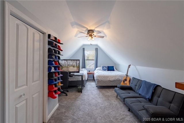 bedroom featuring vaulted ceiling and carpet