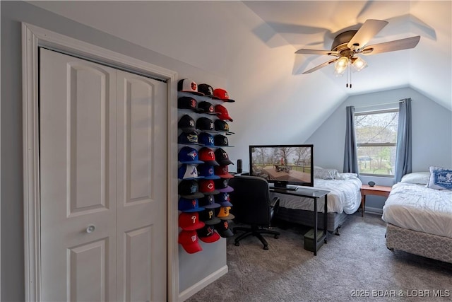 bedroom with lofted ceiling, a ceiling fan, and carpet flooring
