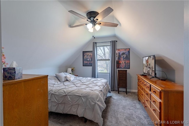 bedroom featuring ceiling fan, vaulted ceiling, and carpet flooring