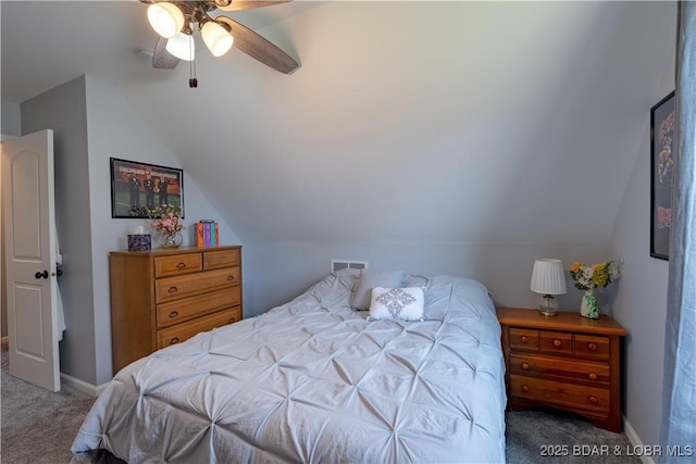 bedroom featuring lofted ceiling, a ceiling fan, baseboards, and carpet floors
