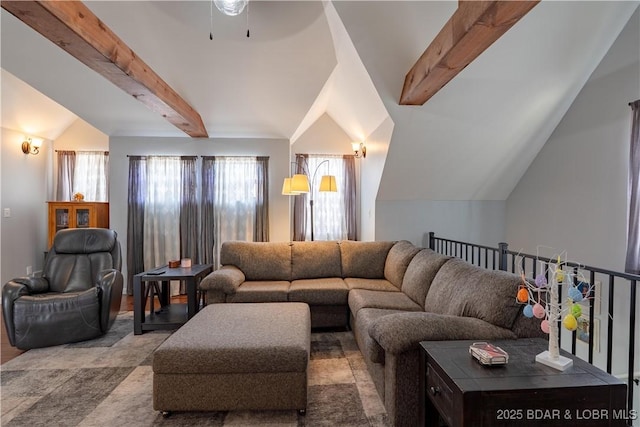 living room featuring a ceiling fan and lofted ceiling with beams
