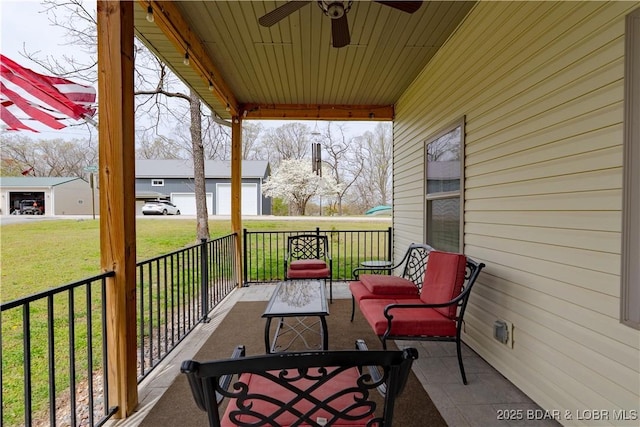 view of patio / terrace featuring a ceiling fan and covered porch