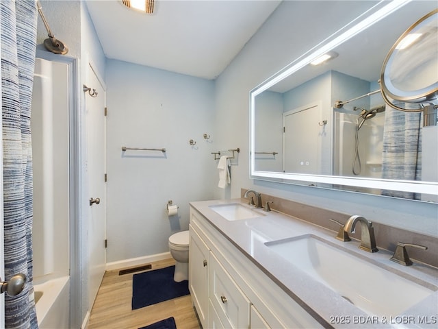 24930 Leona Ln, Versailles, MO 65084 - bathroom with toilet, wood finished floors, a sink, and visible vents