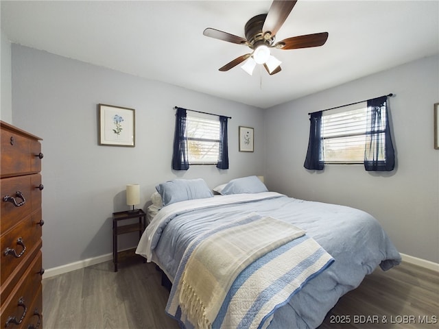 24930 Leona Ln, Versailles, MO 65084 - bedroom with baseboards, wood finished floors, and ceiling fan