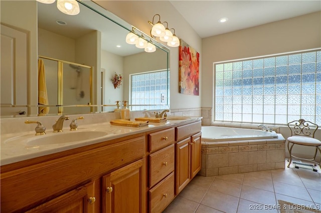 6605 Saint Moritz Dr, Osage Beach, MO 65065 - bathroom featuring a healthy amount of sunlight, tile patterned floors, and a sink