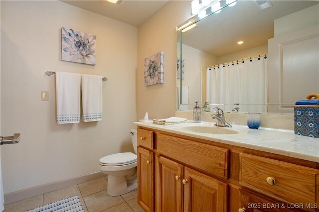 6605 Saint Moritz Dr, Osage Beach, MO 65065 - full bath with toilet, vanity, tile patterned floors, and baseboards
