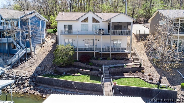 6605 Saint Moritz Dr, Osage Beach, MO 65065 - rear view of property featuring stairway and a balcony