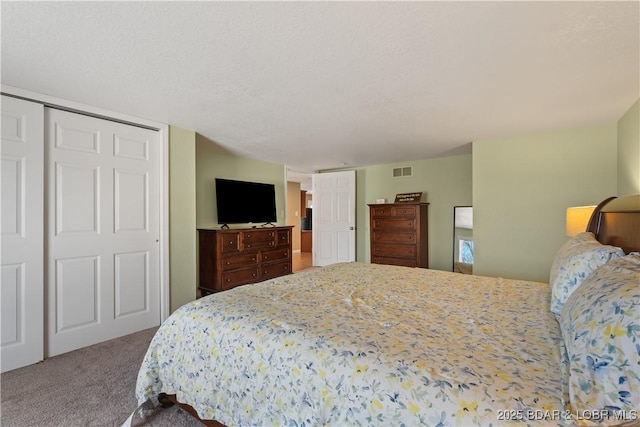 bedroom featuring carpet floors and visible vents