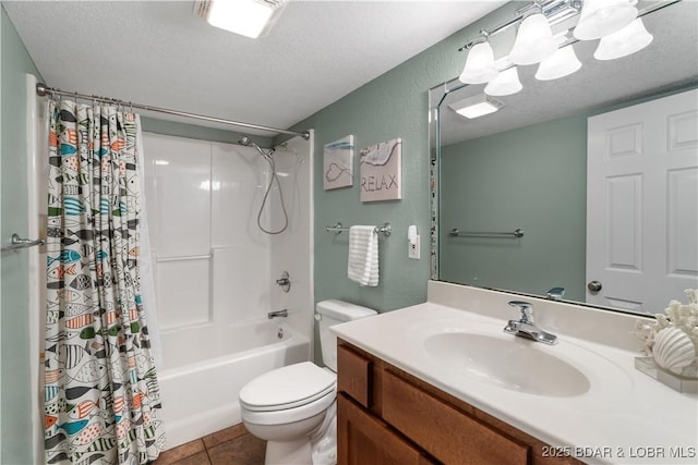bathroom featuring tile patterned floors, toilet, vanity, shower / bath combo with shower curtain, and a textured ceiling