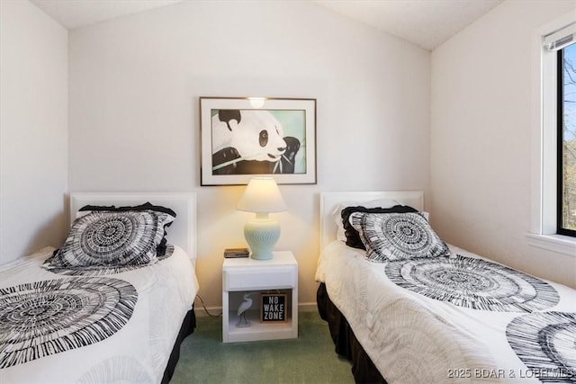 carpeted bedroom with vaulted ceiling and multiple windows