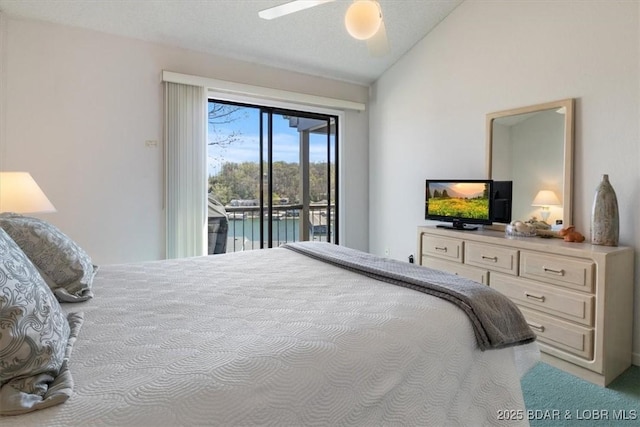 bedroom with lofted ceiling, access to exterior, carpet flooring, and ceiling fan