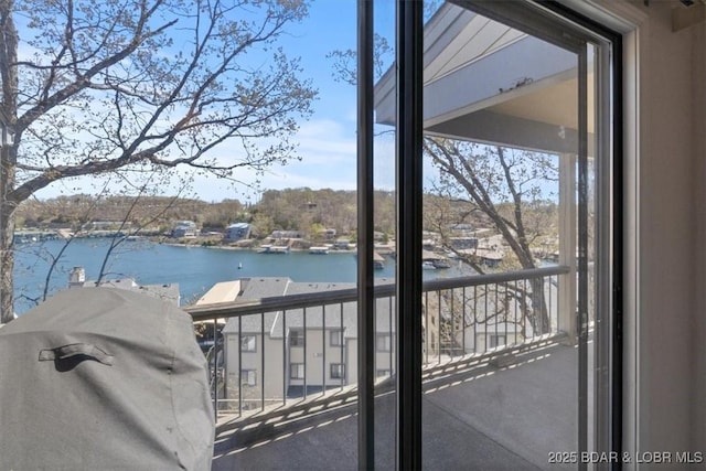 balcony featuring a water view
