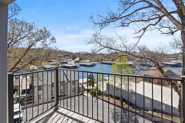 balcony featuring a water view
