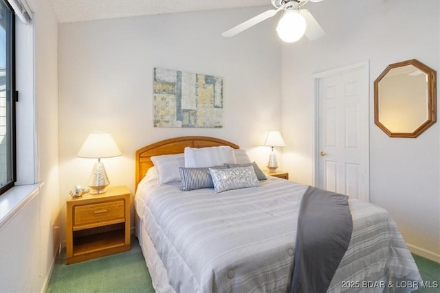 carpeted bedroom featuring baseboards, a ceiling fan, and vaulted ceiling