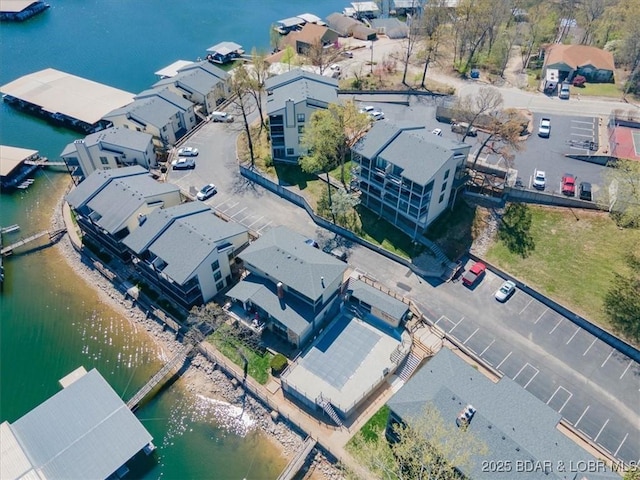 aerial view with a water view and a residential view