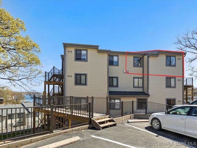 31 Willow Ridge Rd Unit 4B, Lake Ozark, MO 65049 - back of property featuring uncovered parking