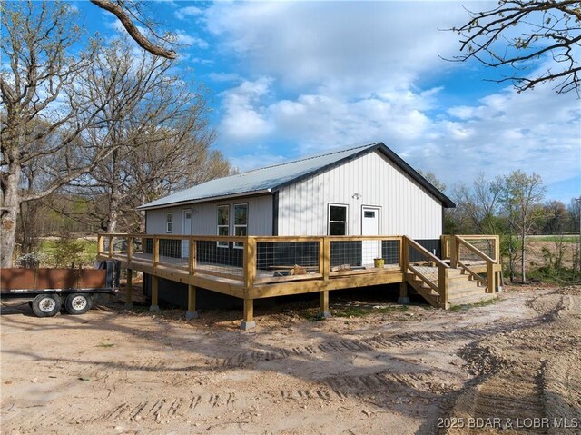 3053 Doc Ridgeway Dr, Roach, MO 65787 - back of property featuring a deck and metal roof