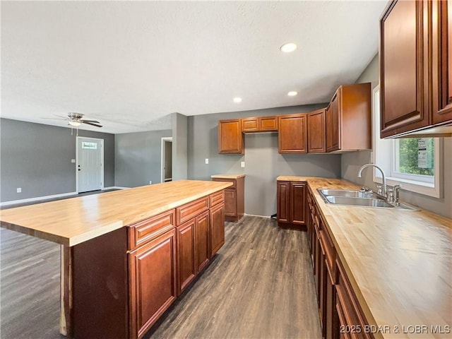 3053 Doc Ridgeway Dr, Roach, MO 65787 - kitchen featuring wood counters, a sink, dark wood-style flooring, healthy amount of natural light, and recessed lighting