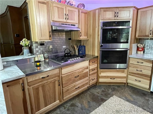 31945 Idle Wild Rd, Gravois Mills, MO 65037 - kitchen with decorative backsplash, appliances with stainless steel finishes, under cabinet range hood, and stainless steel counters