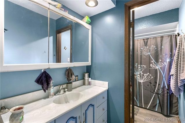 31945 Idle Wild Rd, Gravois Mills, MO 65037 - bathroom with vanity and wood finished floors
