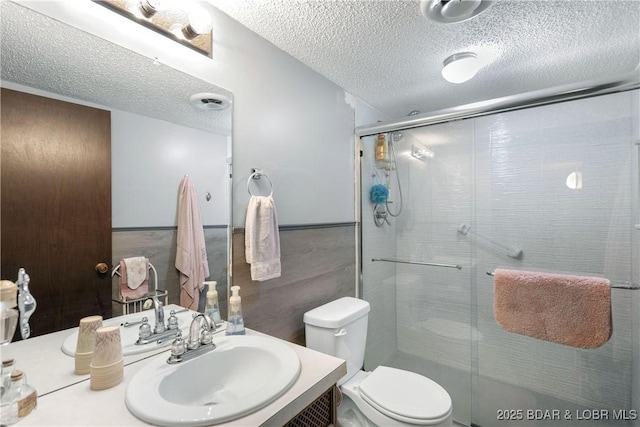 31945 Idle Wild Rd, Gravois Mills, MO 65037 - full bath with vanity, a stall shower, toilet, and a textured ceiling