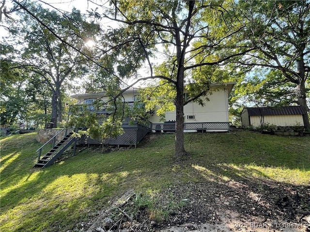 31945 Idle Wild Rd, Gravois Mills, MO 65037 - view of yard with stairs, a storage shed, and an outbuilding