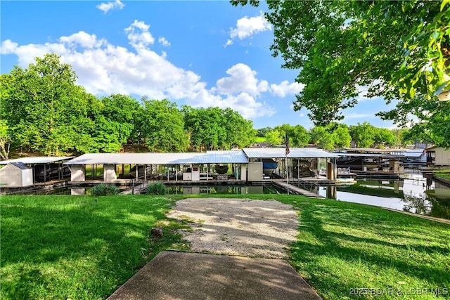 31945 Idle Wild Rd, Gravois Mills, MO 65037 - exterior space featuring a yard, boat lift, a water view, and a dock