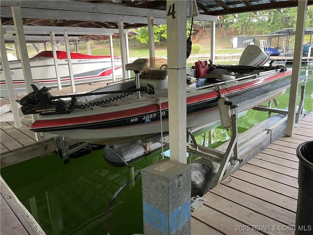 31945 Idle Wild Rd, Gravois Mills, MO 65037 - dock area featuring boat lift