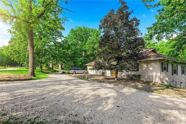 31945 Idle Wild Rd, Gravois Mills, MO 65037 - view of front facade featuring stucco siding