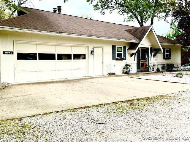 31945 Idle Wild Rd, Gravois Mills, MO 65037 - single story home with a garage, a chimney, driveway, and roof with shingles