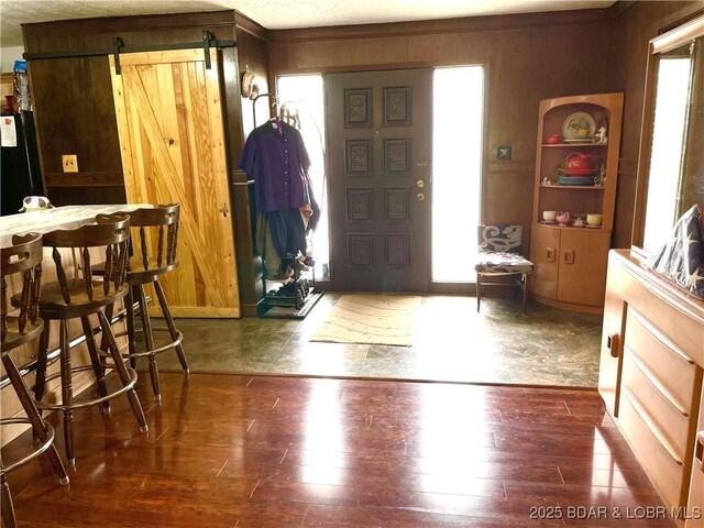 31945 Idle Wild Rd, Gravois Mills, MO 65037 - entrance foyer featuring a barn door and wood finished floors