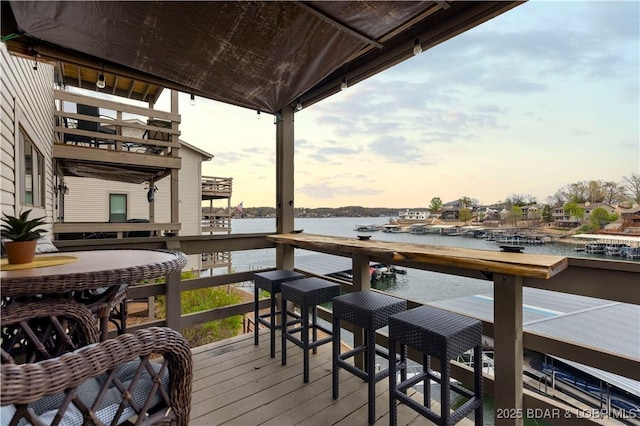wooden deck with a water view