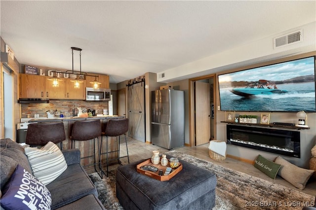 living room featuring visible vents