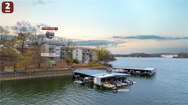 view of dock featuring boat lift and a water view
