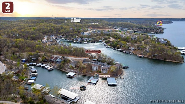 aerial view at dusk with a water view