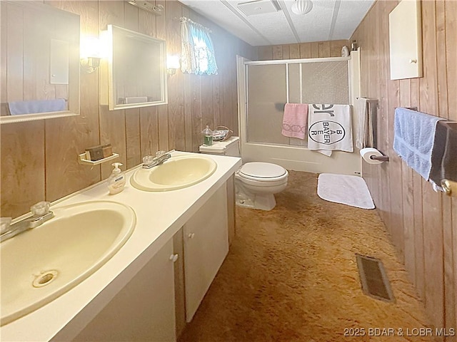 796 1051st Rd SE, Mo, MO 64740 - full bath with wooden walls, visible vents, a sink, and toilet