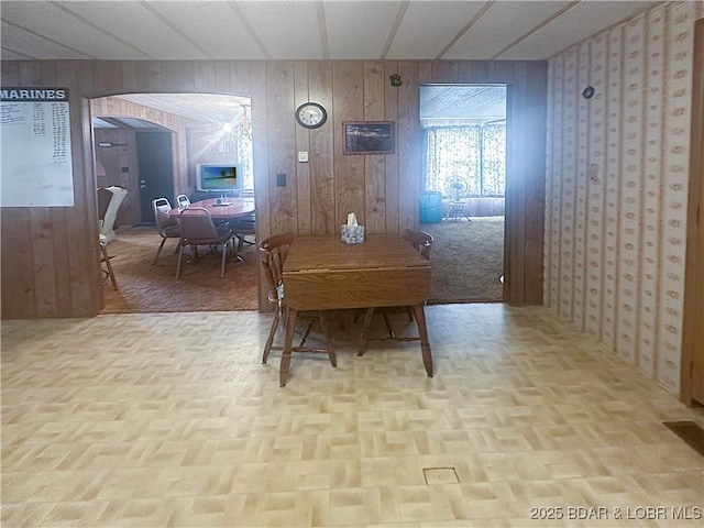 796 1051st Rd SE, Mo, MO 64740 - dining space featuring wooden walls and arched walkways
