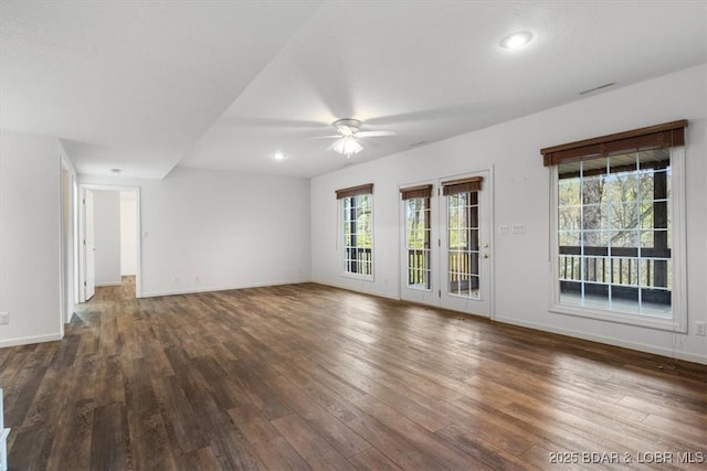 unfurnished living room with ceiling fan, dark wood-type flooring, baseboards, and recessed lighting