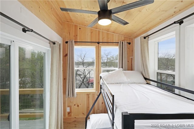 27205 Marina Ln, Barnett, MO 65011 - bedroom with lofted ceiling, wood ceiling, wood walls, wood finished floors, and a ceiling fan