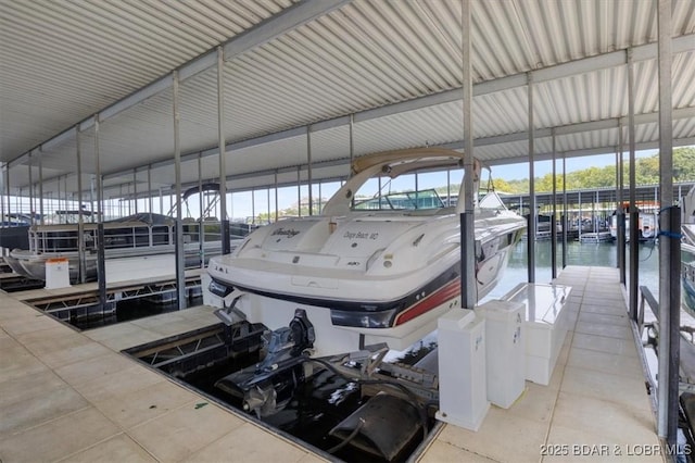 view of dock featuring boat lift and a water view