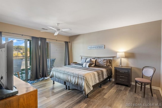 bedroom with ceiling fan, baseboards, access to outside, and wood finished floors
