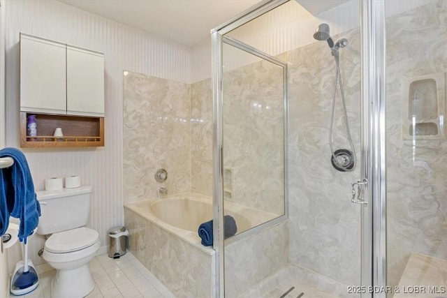bathroom with toilet, a tub, tile patterned floors, and a marble finish shower