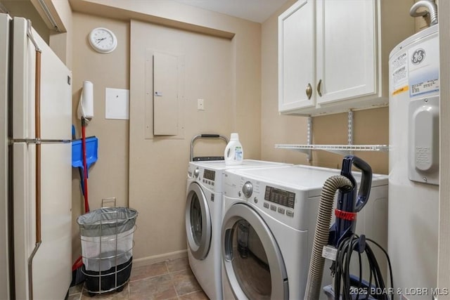 clothes washing area with baseboards, cabinet space, and independent washer and dryer