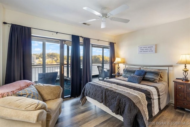 bedroom with a ceiling fan, access to outside, wood finished floors, and visible vents