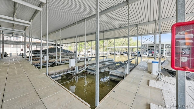 75 Cedar Heights Ln Unit 4D, Camdenton, MO 65020 - dock area featuring boat lift and a water view