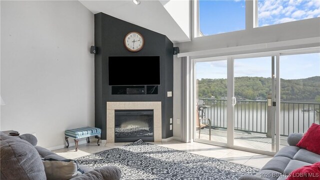 75 Cedar Heights Ln Unit 4D, Camdenton, MO 65020 - tiled living area with high vaulted ceiling and a tile fireplace