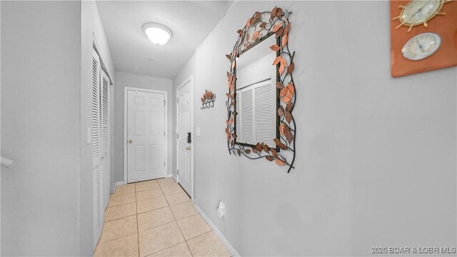 75 Cedar Heights Ln Unit 4D, Camdenton, MO 65020 - corridor featuring light tile patterned floors and baseboards