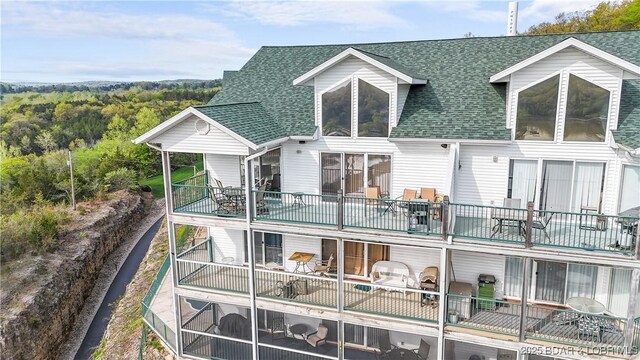 75 Cedar Heights Ln Unit 4D, Camdenton, MO 65020 - back of house featuring roof with shingles