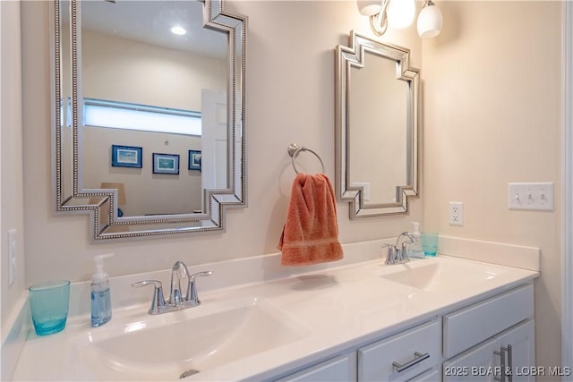 bathroom featuring double vanity
